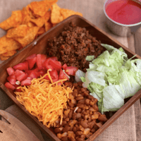 Taco salad with lettuce, cheese, and beans.