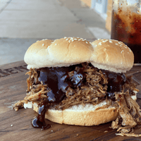 Pulled pork sandwich with barbecue sauce.