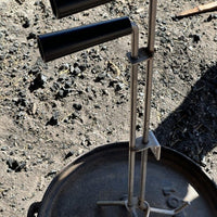 Dutch oven lid lifter with handles.