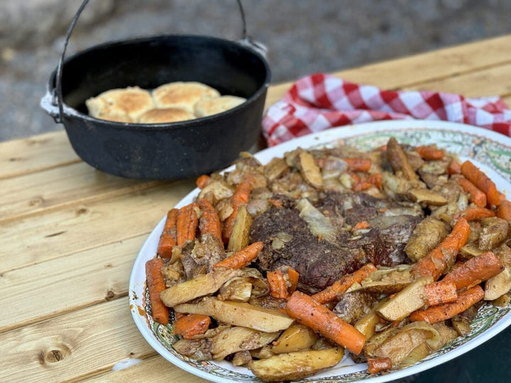 Roast beef dinner with potatoes and carrots.