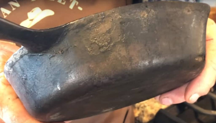 Close up of a seasoned cast iron pan.