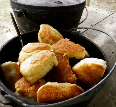 A pan of food sitting on top of the ground.