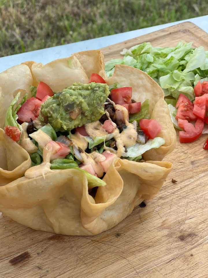Taco salad with guacamole and lettuce.