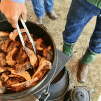 Close-up of barbecued ribs in a pot.