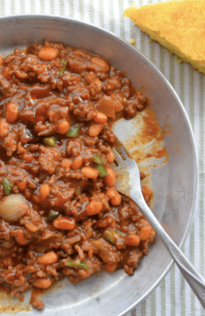 Chili with beans in a metal bowl.