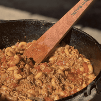 Macaroni and beef stew in a cast iron pot.