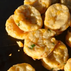 Close-up of golden cheesy biscuits.