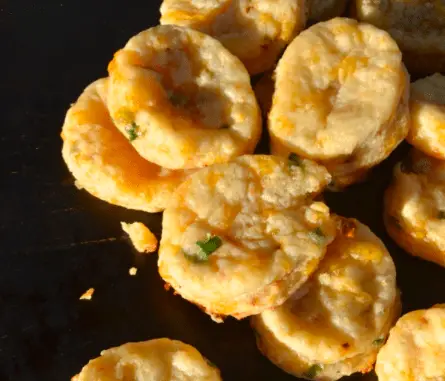 Close-up of golden cheesy biscuits.