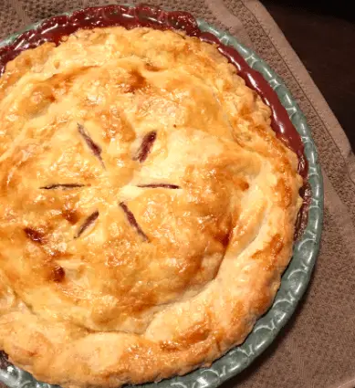 A baked pie with a golden crust.