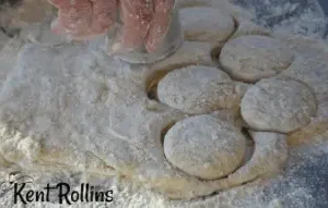 Cutting out dough with a cookie cutter.