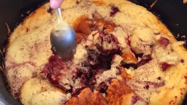 Close up of blackberry cobbler with spoon