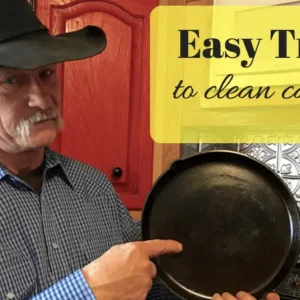 Man holding clean cast iron pan.