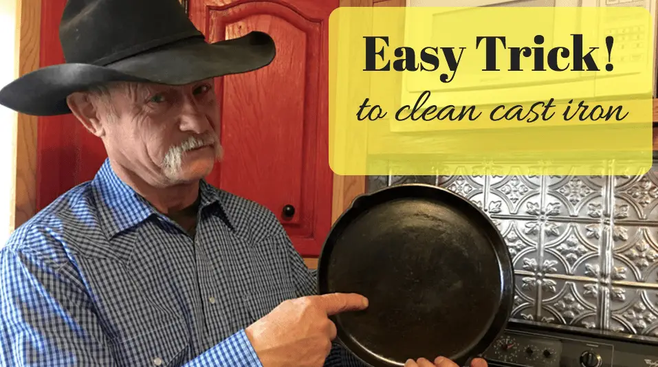 Man holding clean cast iron pan.