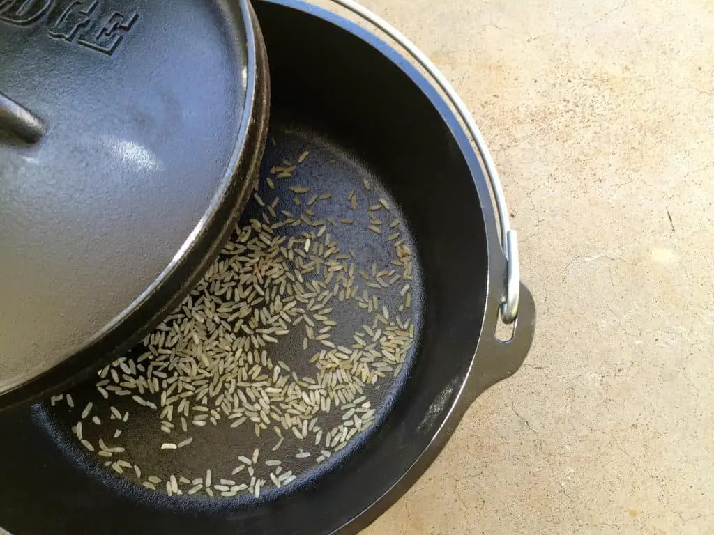 Uncooked rice in a cast iron pot.