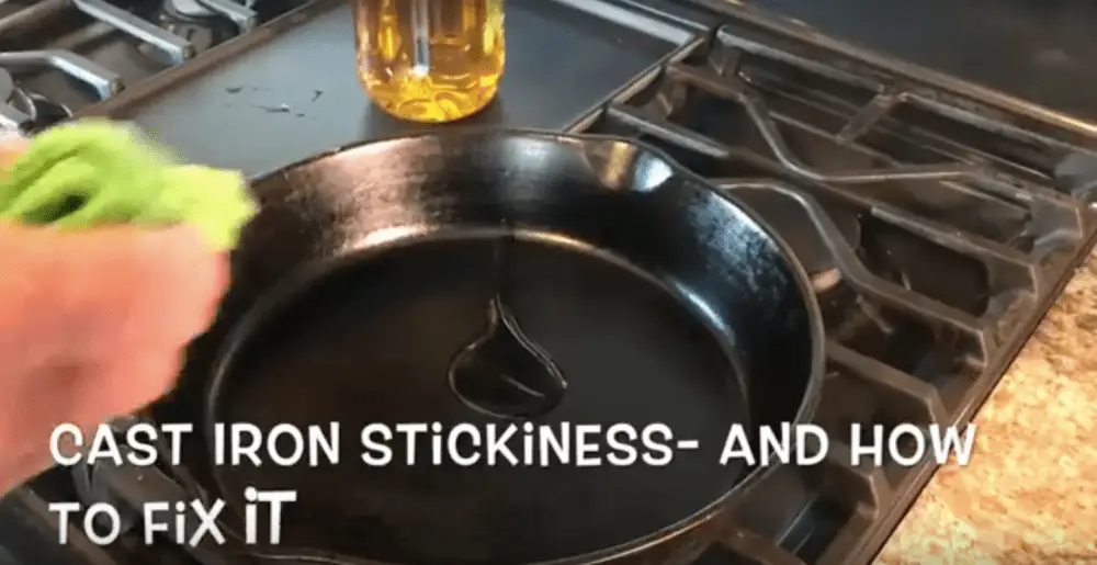 Oil being poured into a cast iron pan.