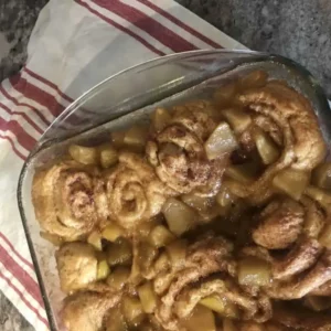 Apple cinnamon rolls in a baking dish.