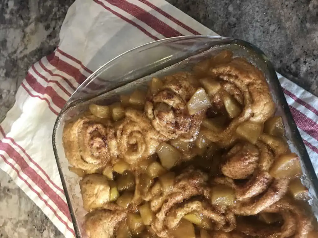 Apple cinnamon rolls in a baking dish.