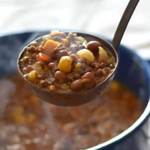 Steaming pot of beef and bean stew.