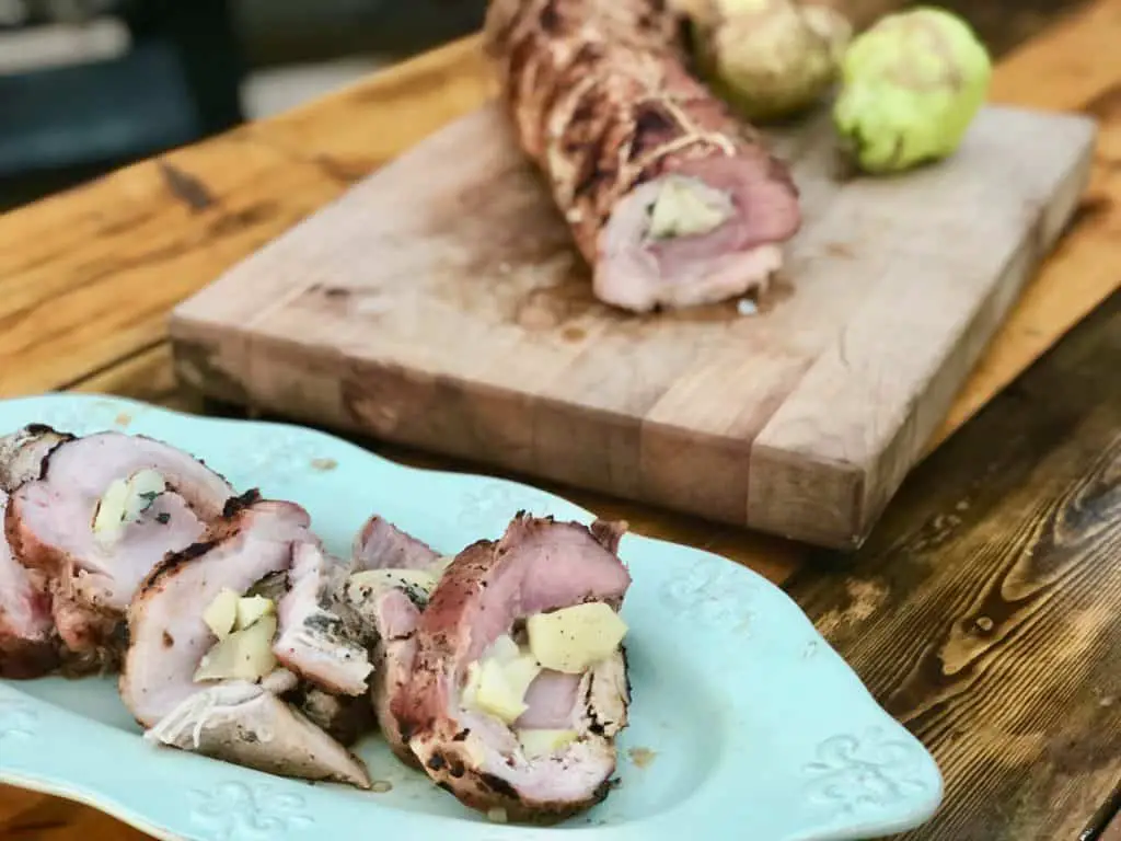 Grilled pork tenderloin stuffed with apples.