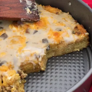 Cheesy breakfast casserole in a pan.