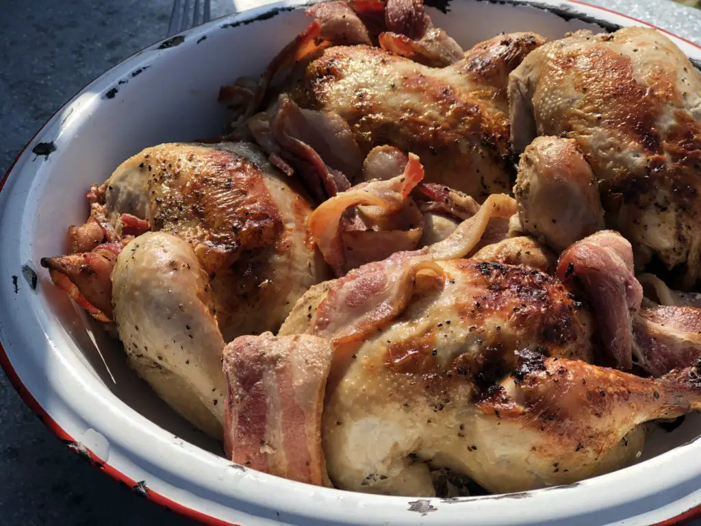 Roasted chicken and bacon in a bowl.