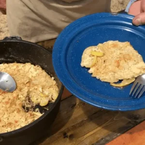 A serving of baked apples with a crispy top.