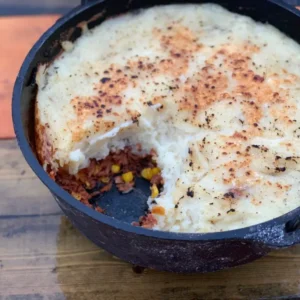 A cast iron pot of shepherd's pie.