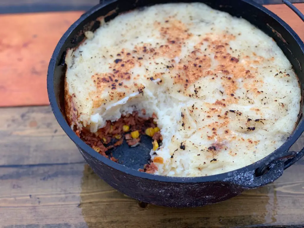 A cast iron pot of shepherd's pie.