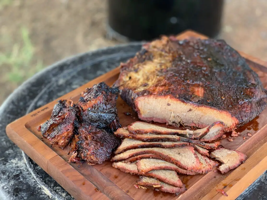 Smoked brisket slices on a cutting board.