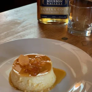 Caramel custard dessert with candied orange.