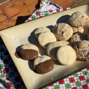 Assortment of cookies on a white plate.