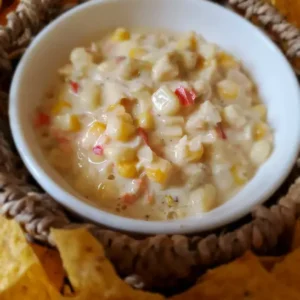 Corn and crab dip with tortilla chips.