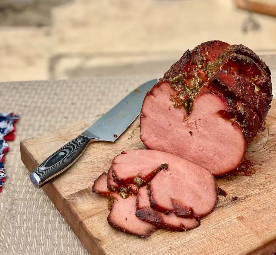 Smoked ham on a cutting board.