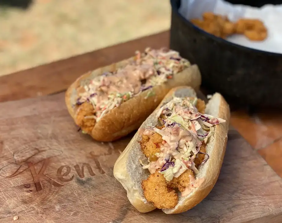 Fried shrimp po'boys with slaw and sauce.