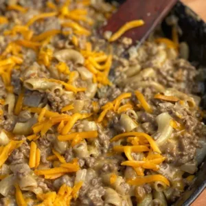 A pan of food with cheese and meat.