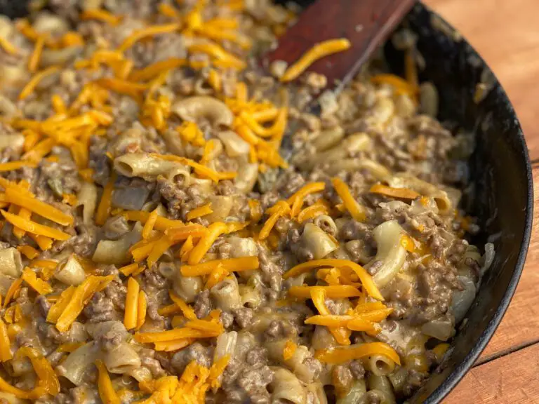 A pan of food with cheese and meat.