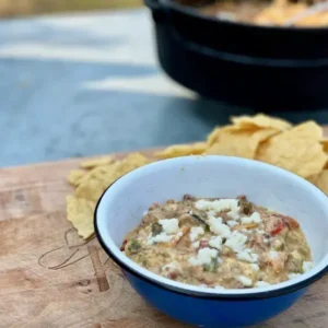 A bowl of food on top of a table.