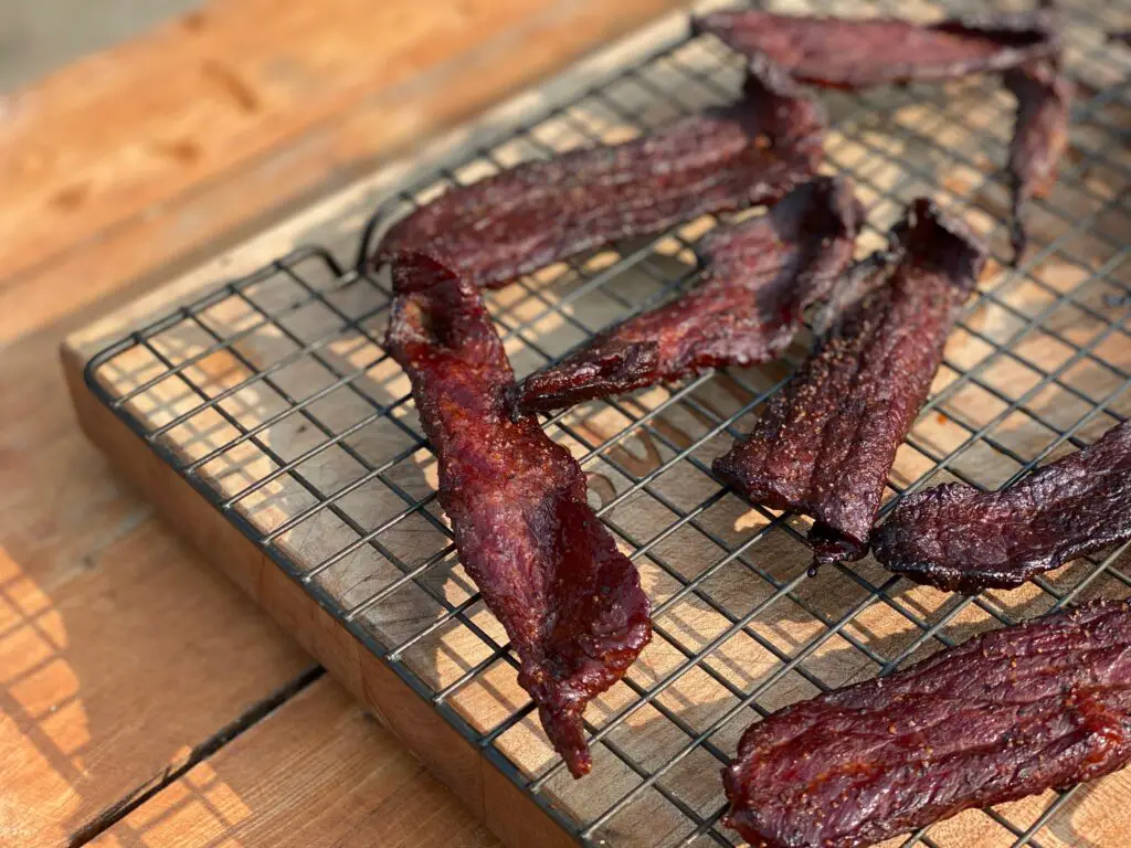 A close up of some bacon on a grill