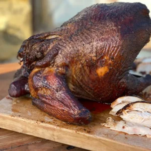 A close up of a turkey on top of a cutting board