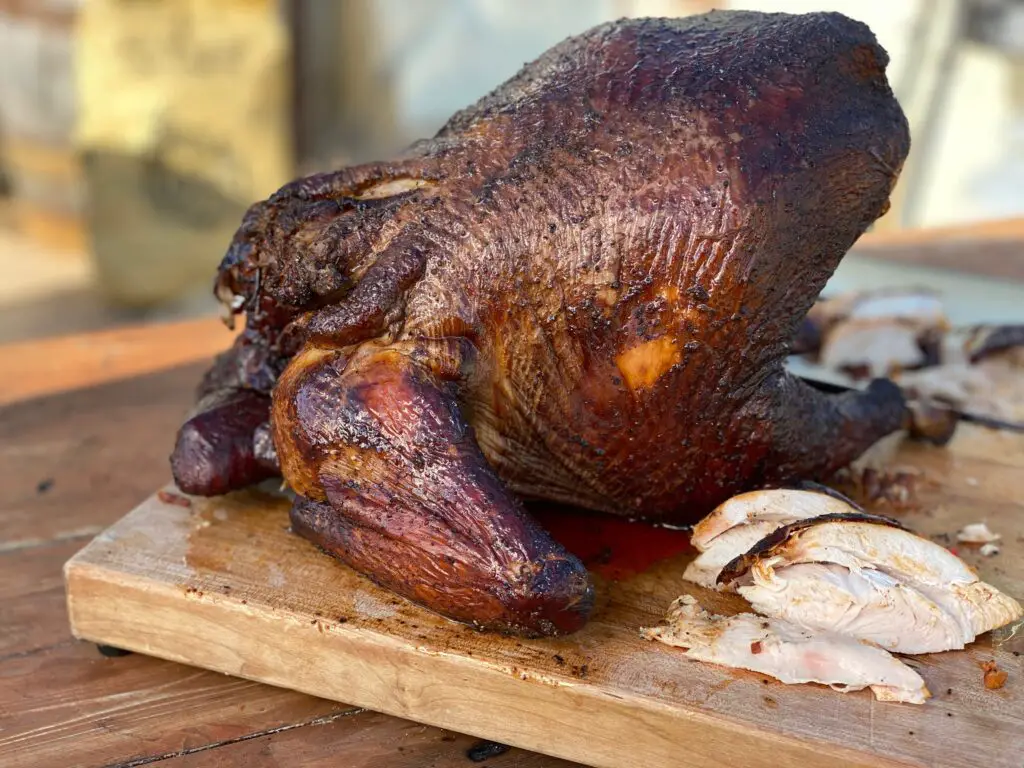 A close up of a turkey on top of a cutting board