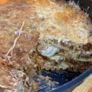 A close up of kent rollins cowboy lasagna in a pan