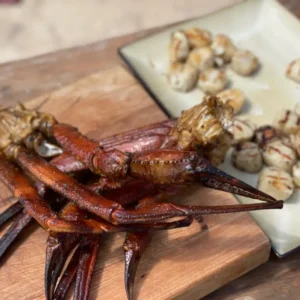 A plate of food on top of a wooden table.