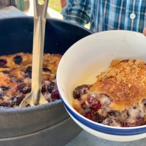 A person holding a bowl of food in front of another bowl.