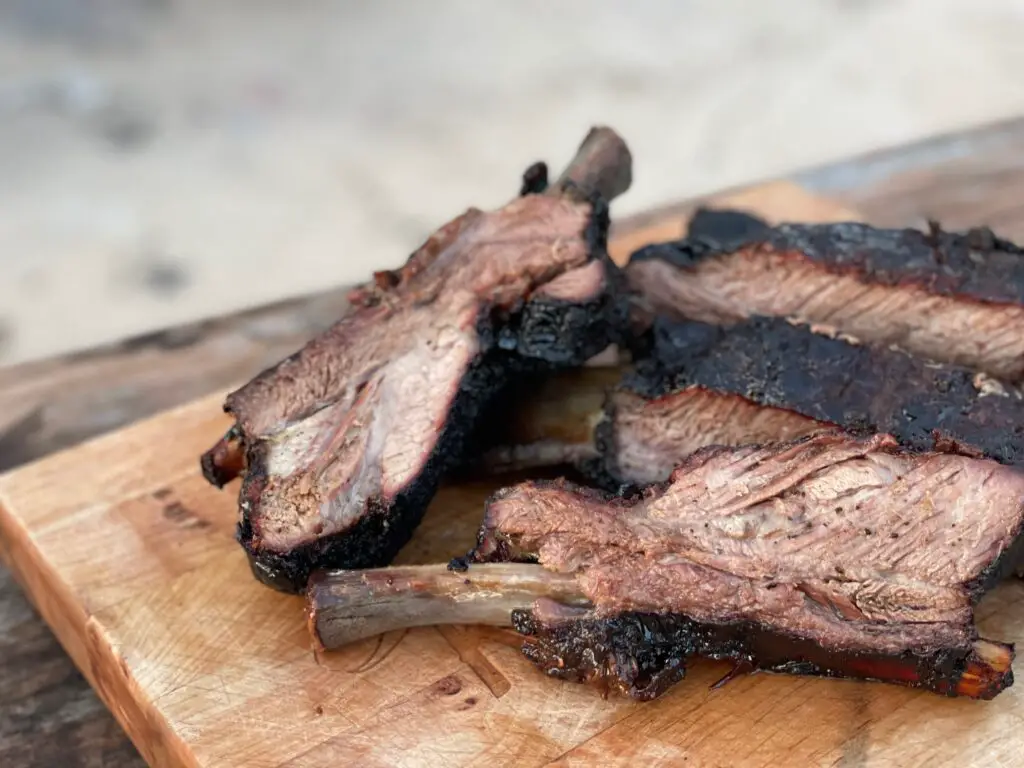 A close up of some meat on the grill