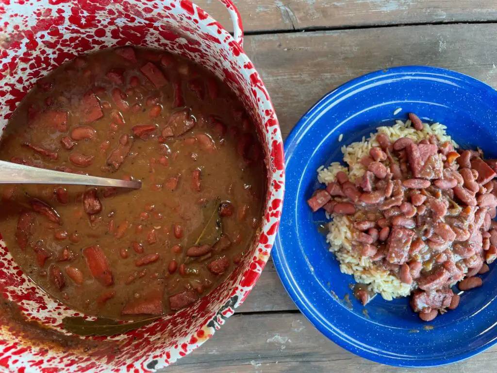 Red beans and rice with meat in a pot and plate.