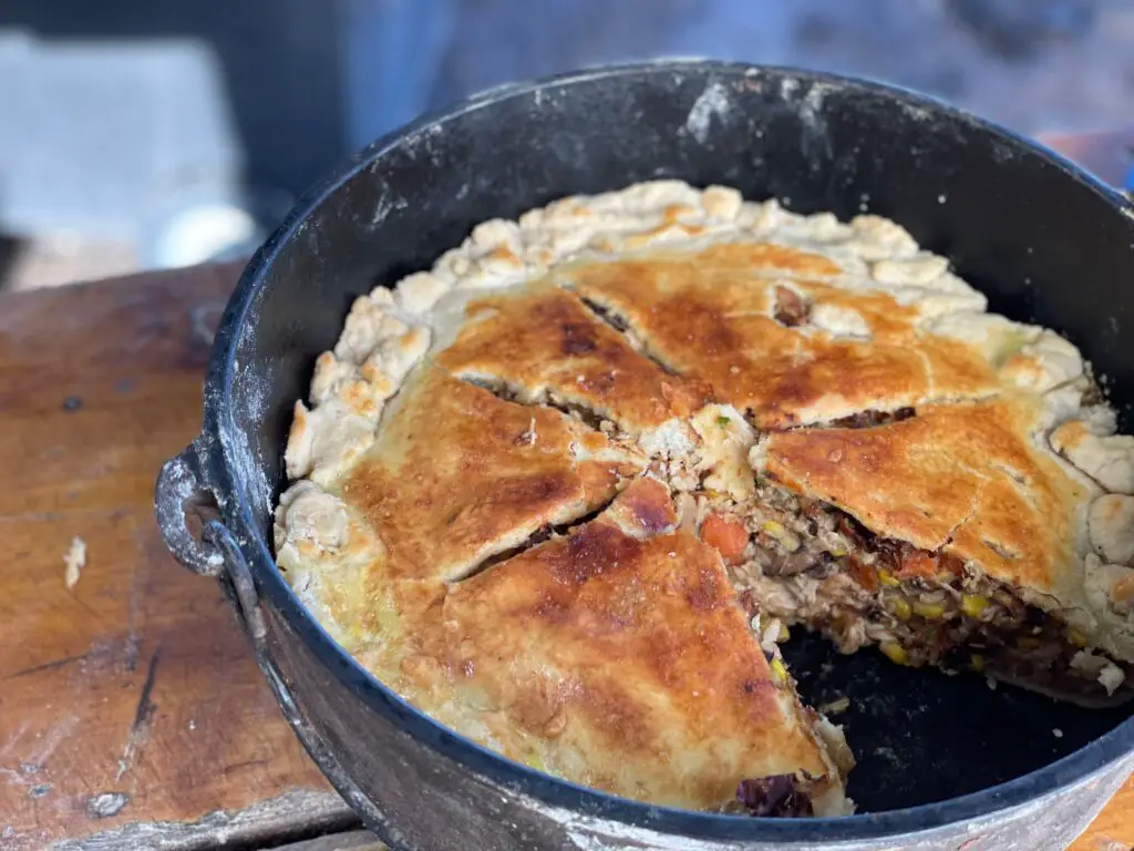 A pie in a pan sitting on top of a table.