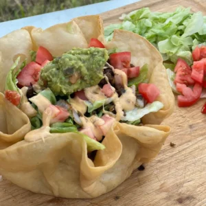 Taco salad with guacamole and lettuce.