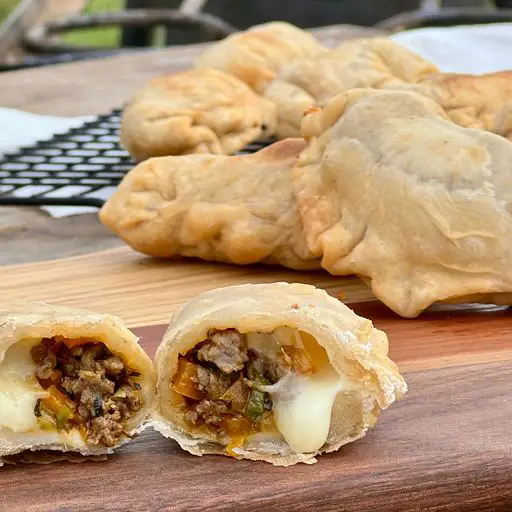 Fried pastries filled with meat and cheese.