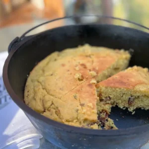 A pan with cornbread in it on the table