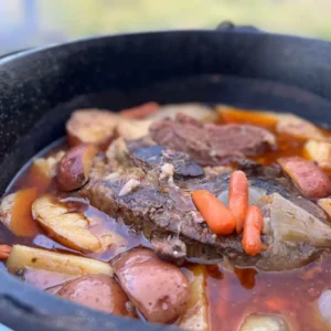 A pot of stew with meat and vegetables in it.